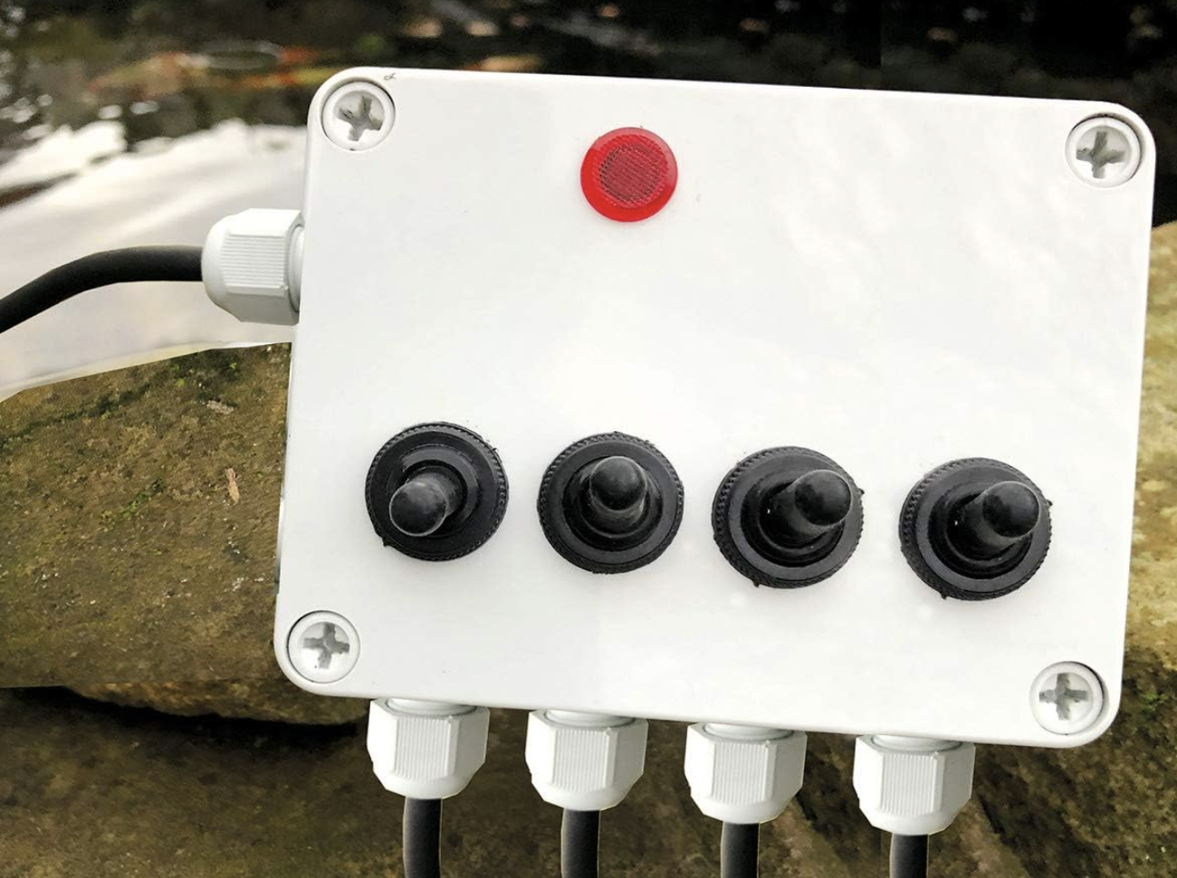 Close up photo of an outdoor pond electrical junction box