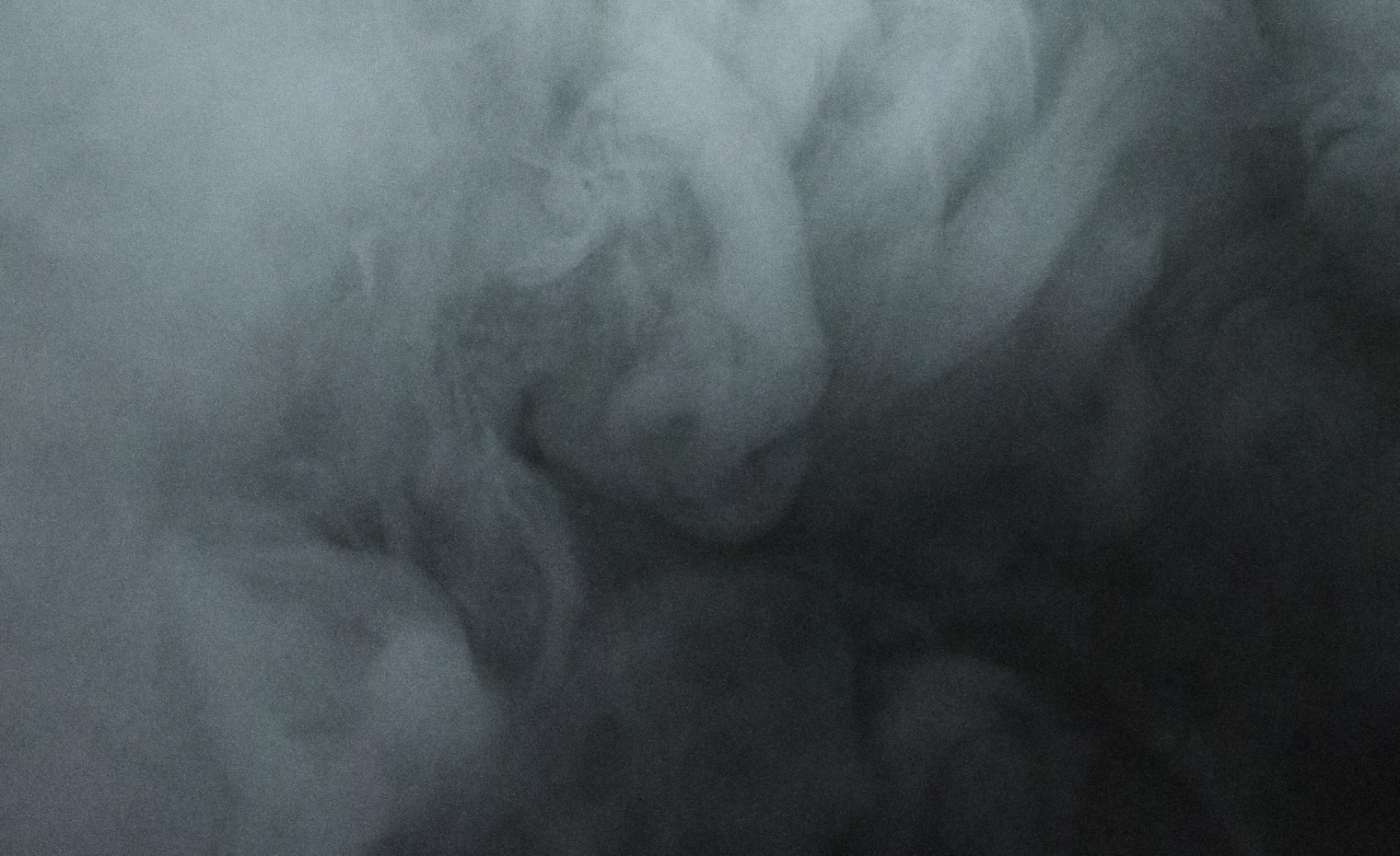 Black and White photo of bonfire smoke